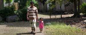 Father and daughter in Indonesia walk together holding hands. Credit: Paul Kadarisman.