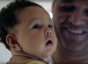 Still of a father and baby from the film "Father Is Not A Visitor."