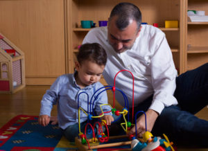 A father and child play together. Photo courtesy of AÇEV.