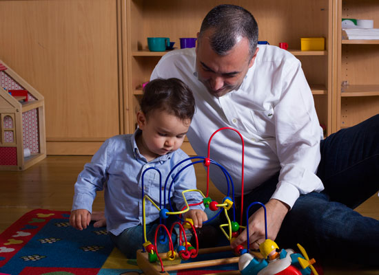 A father and child play together. Photo courtesy of AÇEV.