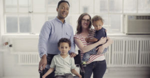 A family looks at the camera in a still from "America's Dads."