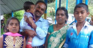 Thangam, Vijayasundaram, and their three children in Sri Lanka.