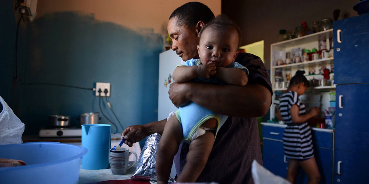 Man holding baby