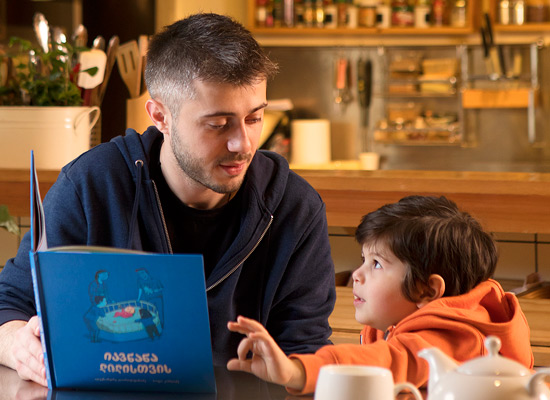 Kakha Kintsurashvili, actor, with his son. Photo courtesy of UNFPA/We Care/Gaga Kapanadze.